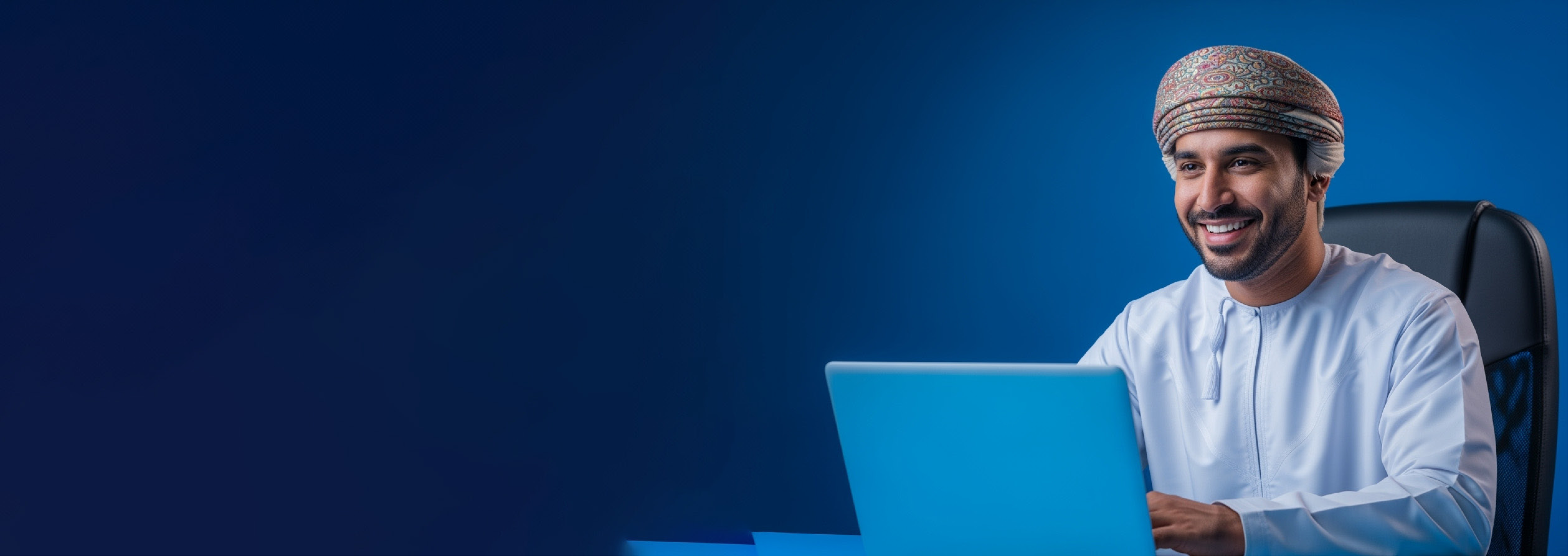 An Omani professional working securely on his laptop